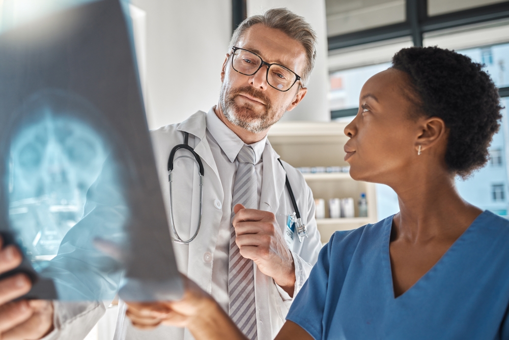 Brain, x ray and neurology doctors in a meeting working on a skull injury