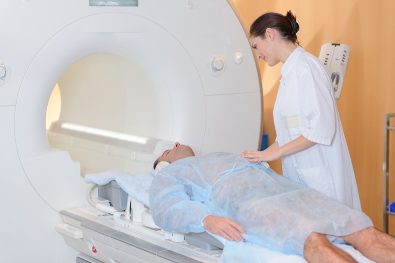 Nurse with patient having mri scan