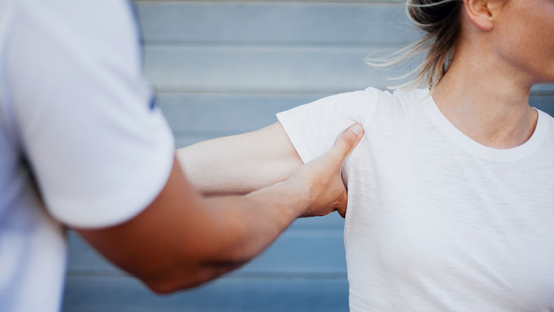 Shoulder dislocation treatment for young female by sports clinician