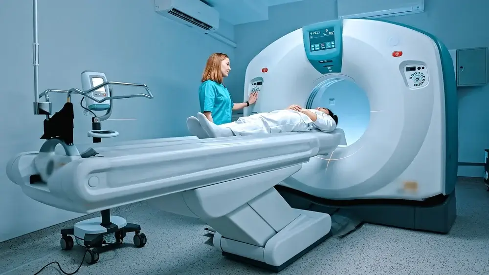 Radiologist consults patient before undergoing diagnostics using magnetic resonance imaging machine in medical center. Patient getting recommendations from doctor before tomography procedure. MRI