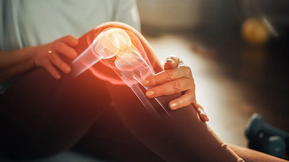 Close Up of a Senior Woman Experiencing Discomfort in a Result of Leg Trauma or Arthritis.