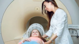 Medical equipment. Doctor and patient in MRI room at hospital.